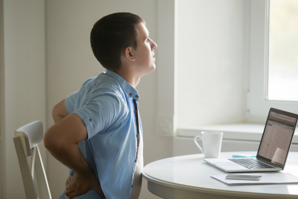 profile-portrait-man-laptop-stretching-backache-position (1).jpg