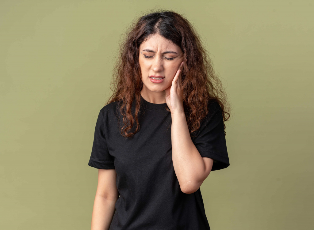 aching-young-pretty-girl-keeping-hand-cheek-having-toothache-with-closed-eyes (1).jpg